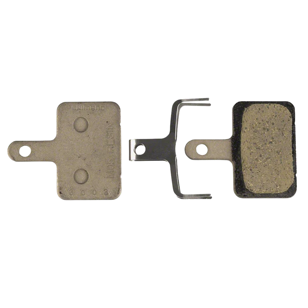 Shimano M05 resin brake pads with spring and hardware – available at Hattons Umhlanga